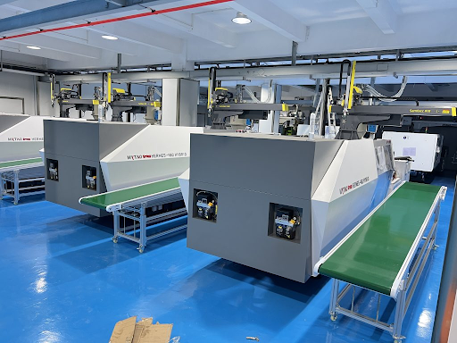 Saving Space and Reducing Risk: Automation Around a Vertical Injection Molding Machine